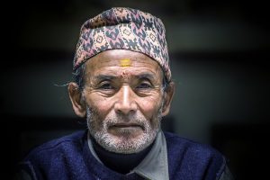 A Nepali Old Man Wearing a Dhaka Topi
